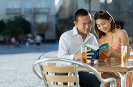 Choose the Right Guidebook guidebook tourists travel travelers cafe table